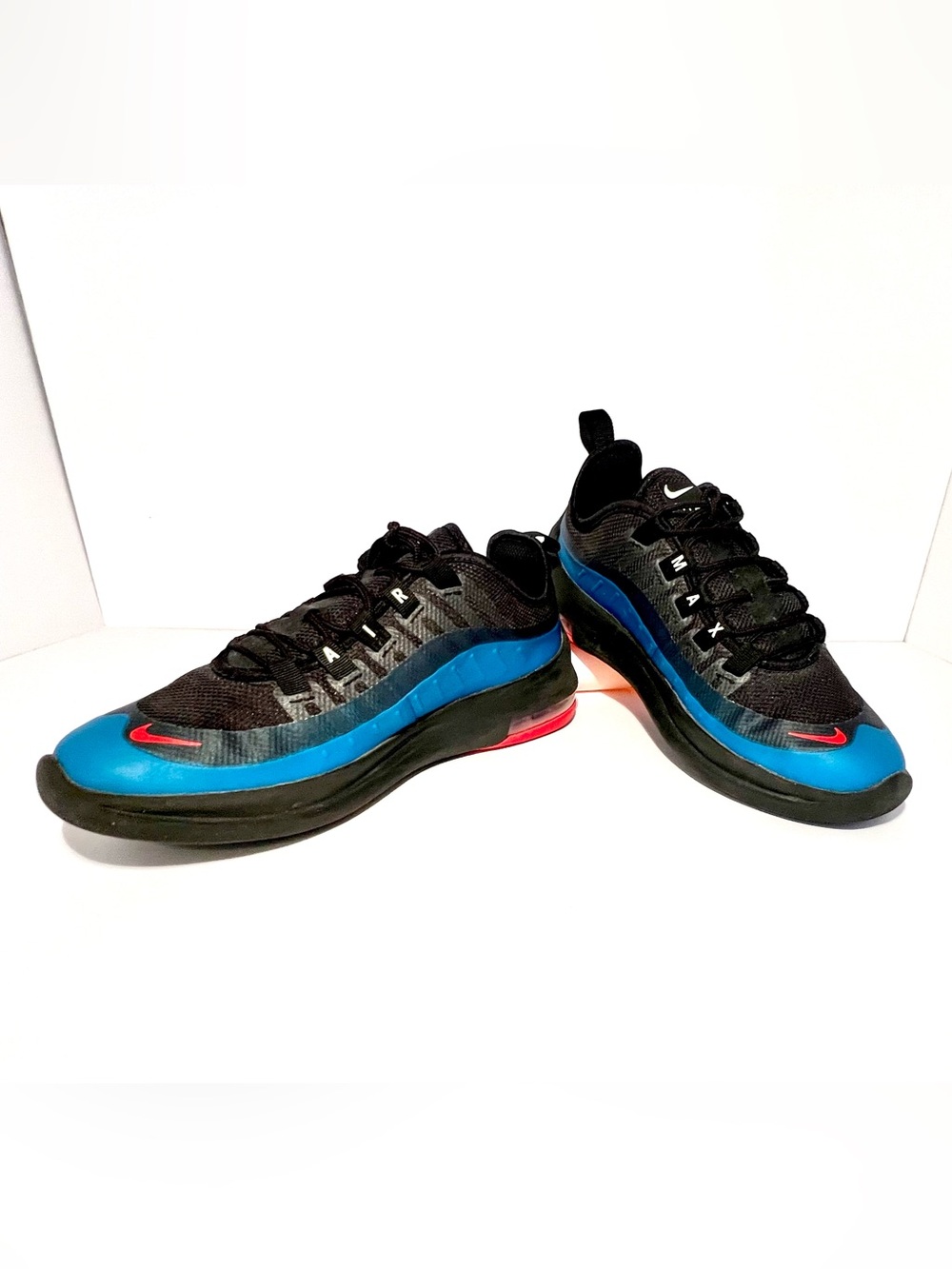 Nike Black and Blue Sneakers with Red Swoosh, Glow-in-the-dark details